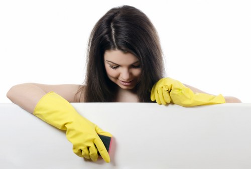 Cleaning staff using protective equipment while handling products safely