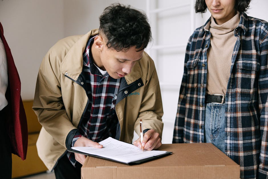 Close-up of a person's hands holding a clipboard with a detailed home inspection checklist titled 'Total Home Inspection Checklist' and a black pen. The person is wearing a light blue shirt and a high